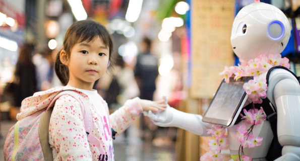 Girl makes friends with a robot